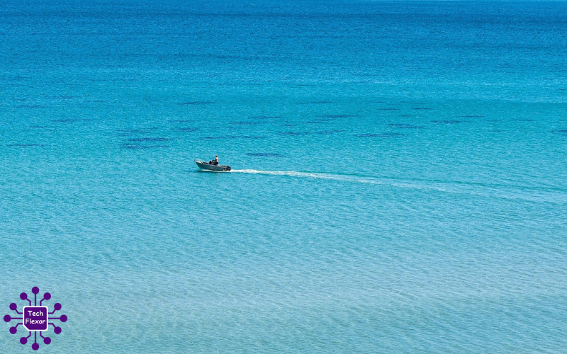 A peaceful veneajelu boat journey across calm blue water under an open sky