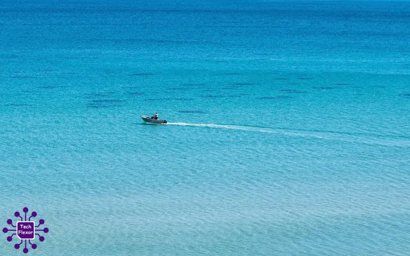 A peaceful veneajelu boat journey across calm blue water under an open sky